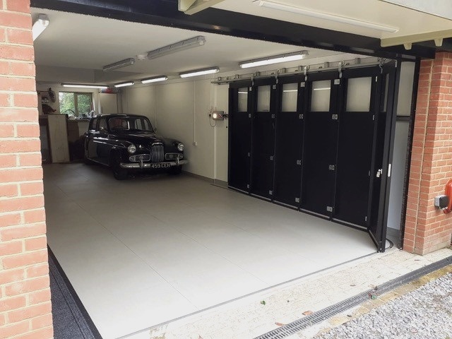 Rundum Meir timber bespoke side sliding sectional garage door.